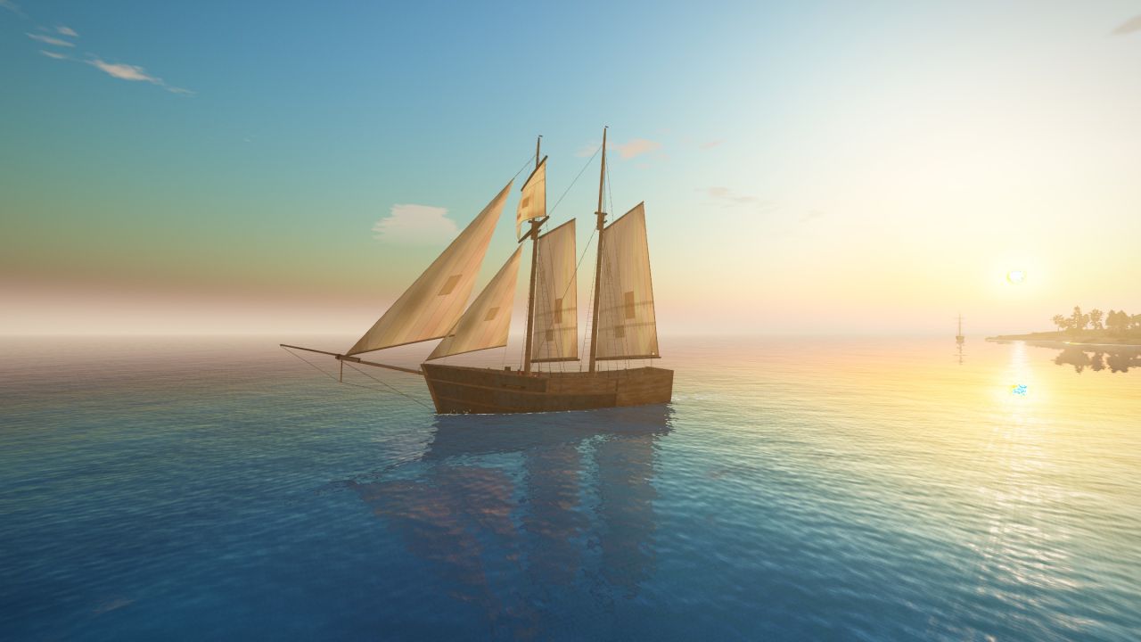 The Modular Schooner under full sail off a wooded island at sunset